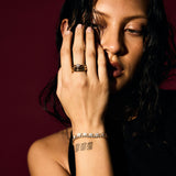 Woman with jewelry on a dark background