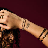 Stacked gold Evil Eye and Tennis Bracelets