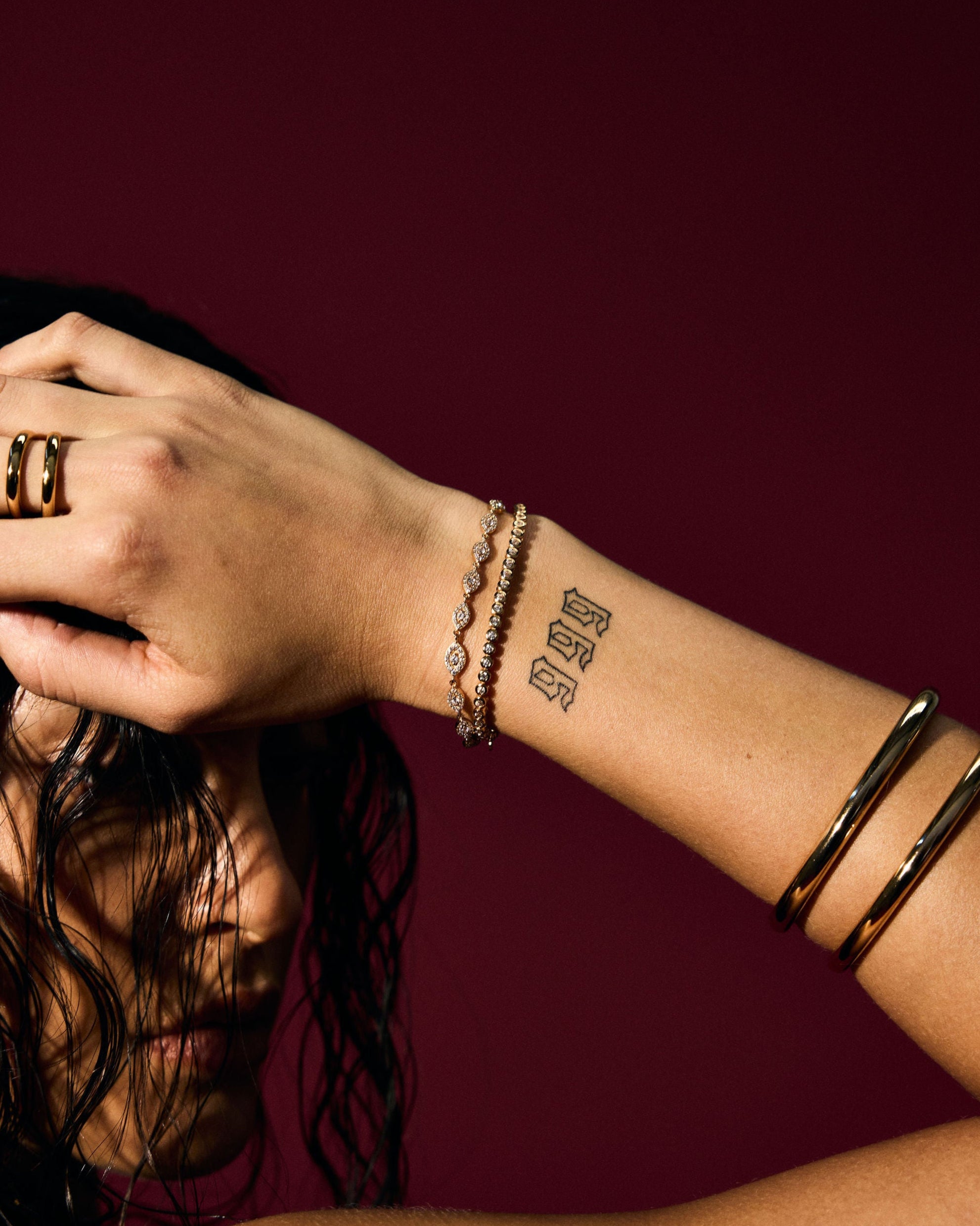 Stacked gold Evil Eye and Tennis Bracelets