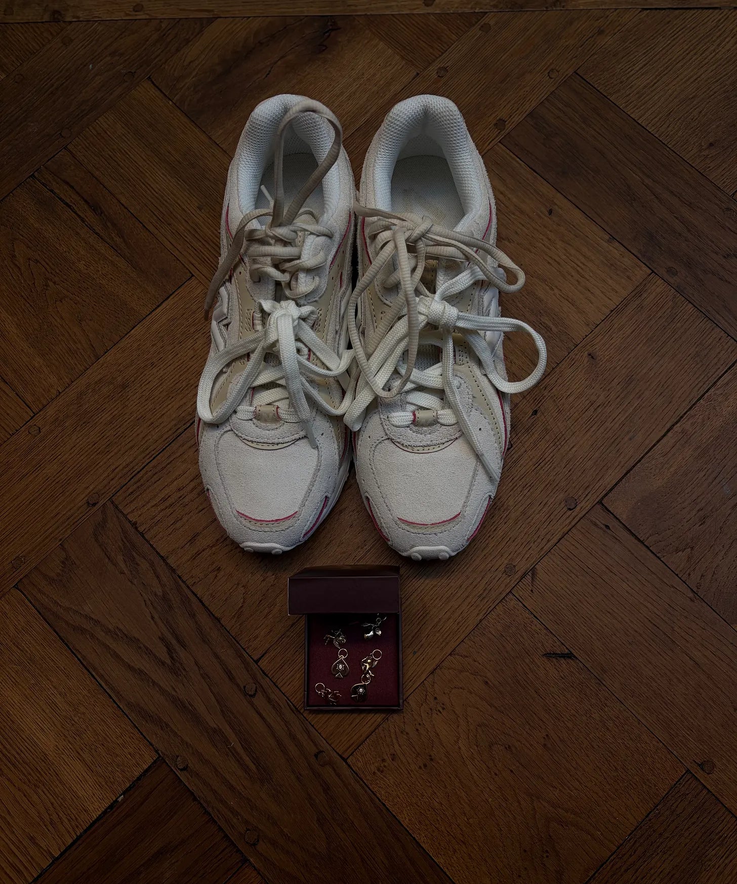 zara wong wearing her New Balance 204L sneakers with YCL gold charms threaded through the laces