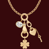 Gold necklace with various charms on a white background