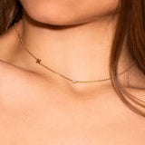 Neckline of woman with fine gold necklace